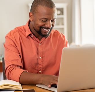 Man working on laptop.